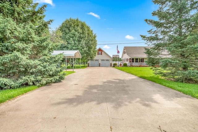 31688 Colon Rd, Colon, MI 49040 - view of front of house with a garage, a front lawn, an outbuilding, and a porch