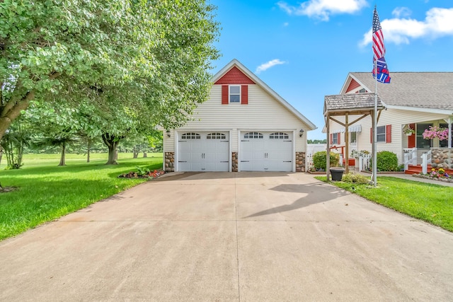 31688 Colon Rd, Colon, MI 49040 - view of front of property featuring stone siding, a front lawn, and a detached garage