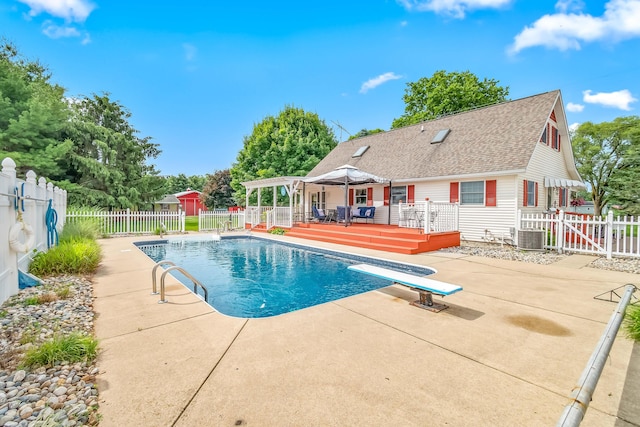 31688 Colon Rd, Colon, MI 49040 - view of pool featuring a patio, a deck, a fenced backyard, and a diving board