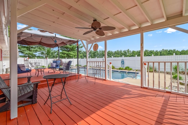 31688 Colon Rd, Colon, MI 49040 - deck with a fenced backyard, outdoor dining space, and ceiling fan