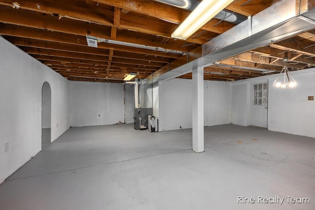 757 E Sidney Rd, Stanton, MI 48888 - below grade area with heating unit and arched walkways