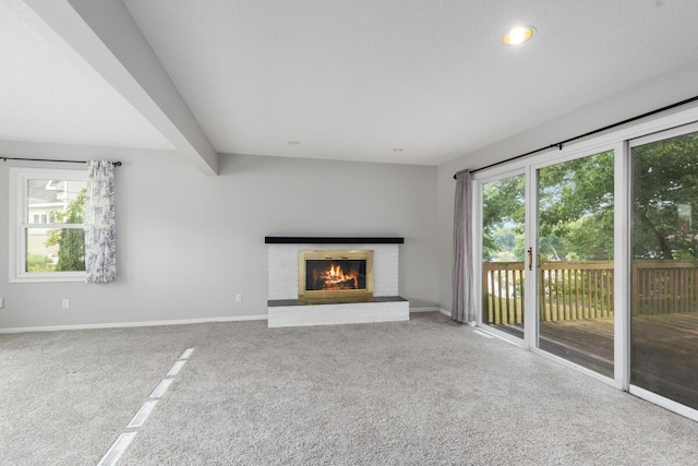2647 Manitoba Ct NE, Grand Rapids, MI 49525 - unfurnished living room featuring carpet floors, a fireplace, and recessed lighting