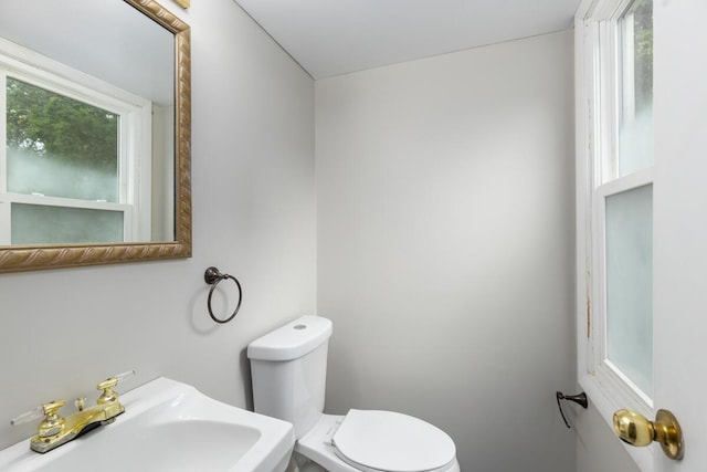 2647 Manitoba Ct NE, Grand Rapids, MI 49525 - half bathroom featuring a sink and toilet