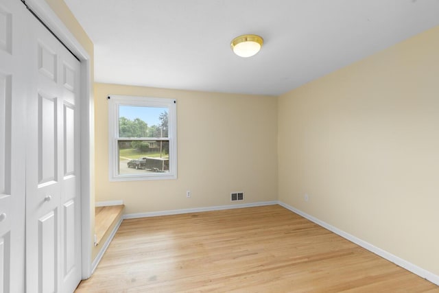 2647 Manitoba Ct NE, Grand Rapids, MI 49525 - unfurnished bedroom with light wood finished floors and a closet