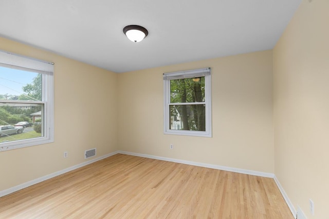 2647 Manitoba Ct NE, Grand Rapids, MI 49525 - unfurnished room featuring light wood-style floors and healthy amount of natural light
