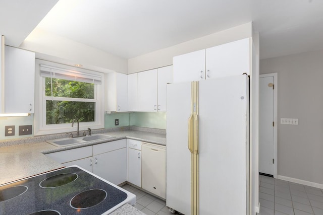 2647 Manitoba Ct NE, Grand Rapids, MI 49525 - kitchen with white appliances, light tile patterned floors, white cabinets, and light countertops