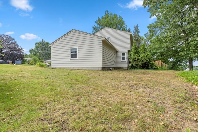 2647 Manitoba Ct NE, Grand Rapids, MI 49525 - view of home's exterior featuring a yard