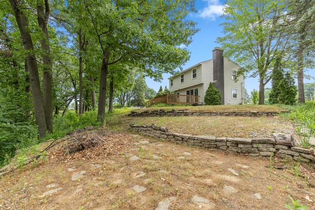 2647 Manitoba Ct NE, Grand Rapids, MI 49525 - view of yard featuring a deck
