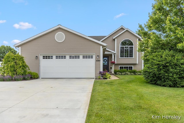 4284 Ives Farm Ln NE, Cedar Springs, MI 49319 - view of front of house with concrete driveway, a front yard, and an attached garage