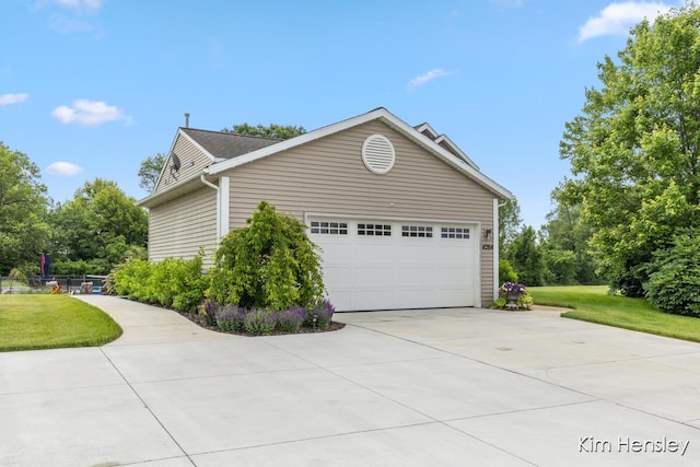 4284 Ives Farm Ln NE, Cedar Springs, MI 49319 - view of side of home with driveway and a garage