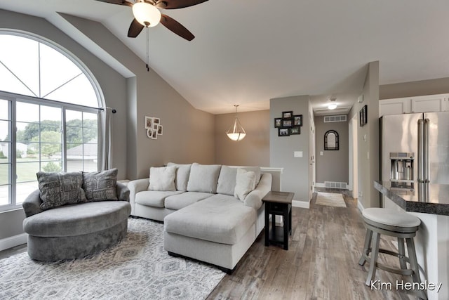 4284 Ives Farm Ln NE, Cedar Springs, MI 49319 - living room featuring ceiling fan, wood finished floors, and vaulted ceiling