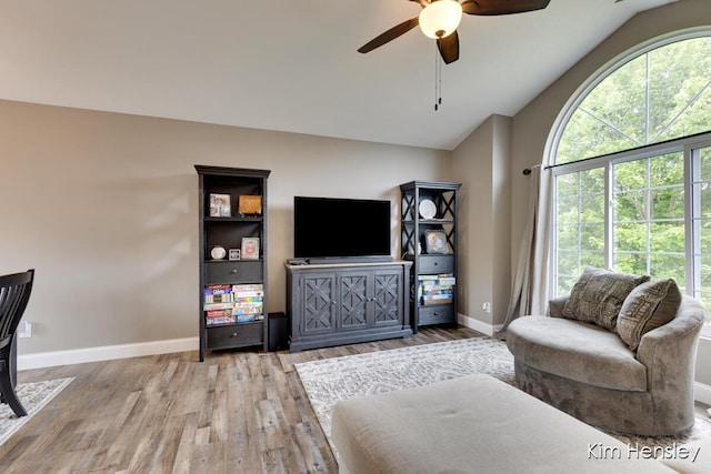 4284 Ives Farm Ln NE, Cedar Springs, MI 49319 - living room with wood finished floors, ceiling fan, and lofted ceiling