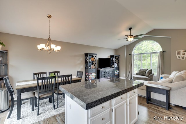 4284 Ives Farm Ln NE, Cedar Springs, MI 49319 - kitchen with a chandelier, lofted ceiling, ceiling fan, open floor plan, and wood finished floors