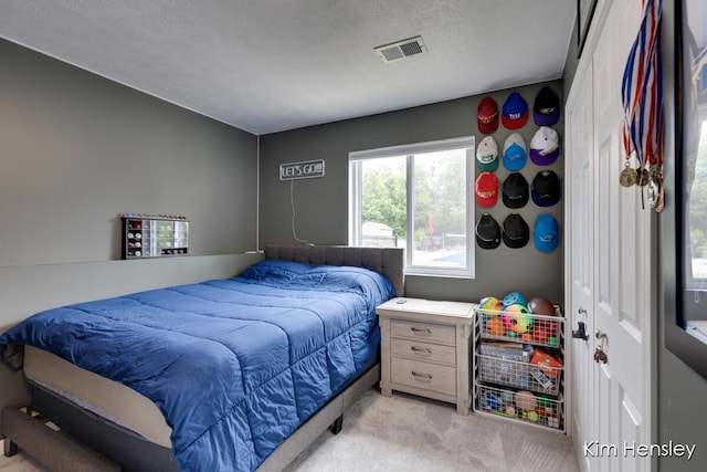 4284 Ives Farm Ln NE, Cedar Springs, MI 49319 - bedroom with light carpet and a textured ceiling