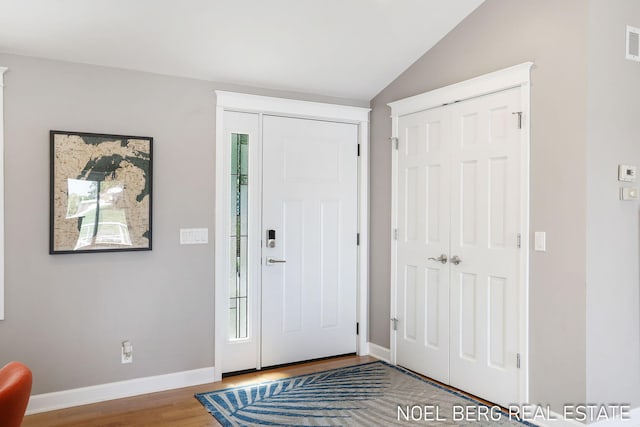 16093 Harbor Point Dr, Spring Lake, MI 49456 - entryway with wood finished floors and lofted ceiling