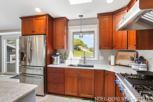 16093 Harbor Point Dr, Spring Lake, MI 49456 - kitchen featuring stainless steel fridge, exhaust hood, decorative backsplash, decorative light fixtures, and a skylight