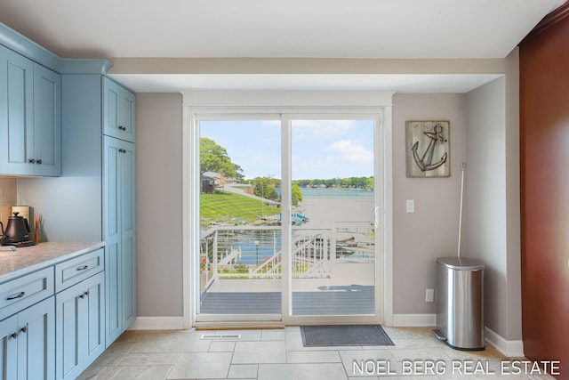 16093 Harbor Point Dr, Spring Lake, MI 49456 - doorway featuring light tile patterned floors and a water view