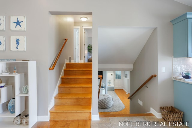 16093 Harbor Point Dr, Spring Lake, MI 49456 - stairs with wood finished floors and baseboards