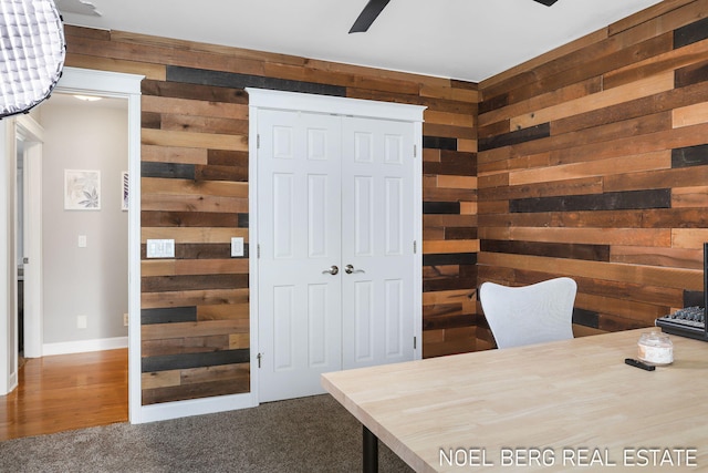 16093 Harbor Point Dr, Spring Lake, MI 49456 - office space featuring wood walls, a ceiling fan, and carpet flooring