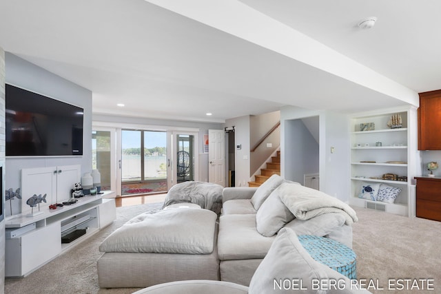 16093 Harbor Point Dr, Spring Lake, MI 49456 - carpeted living room featuring a water view, stairway, built in features, and recessed lighting