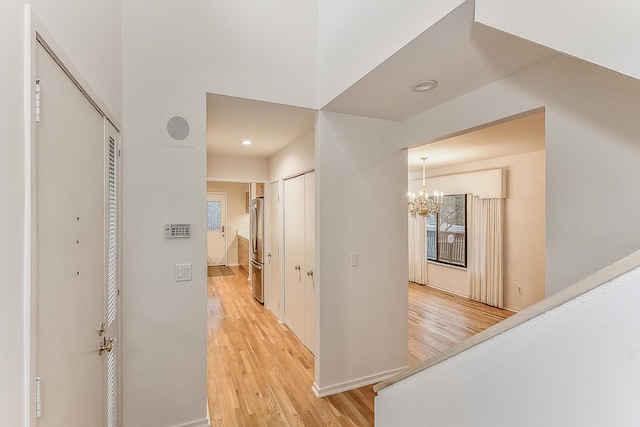 22 Haverhill Ct, Ann Arbor, MI 48105 - corridor featuring light wood-style flooring, a chandelier, and recessed lighting