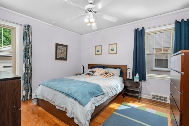 22836 Wellington St, Dearborn, MI 48124 - bedroom featuring wood finished floors, ornamental molding, and a ceiling fan
