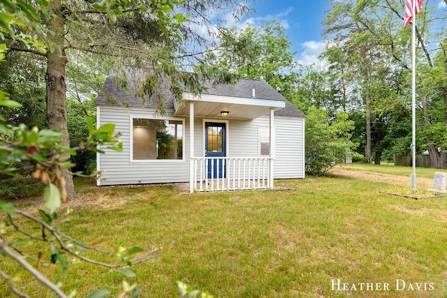 4578 135th Ave, Hamilton, MI 49419 - view of front facade featuring a front yard, roof with shingles, and a porch