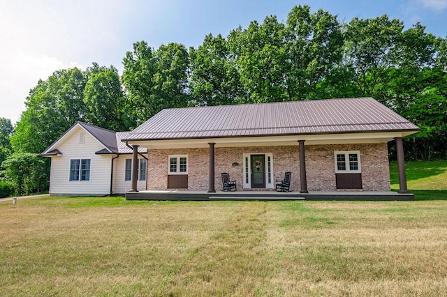 5412 Blackberry Ln, Coloma, MI 49038 - view of front facade featuring a front lawn and a metal roof