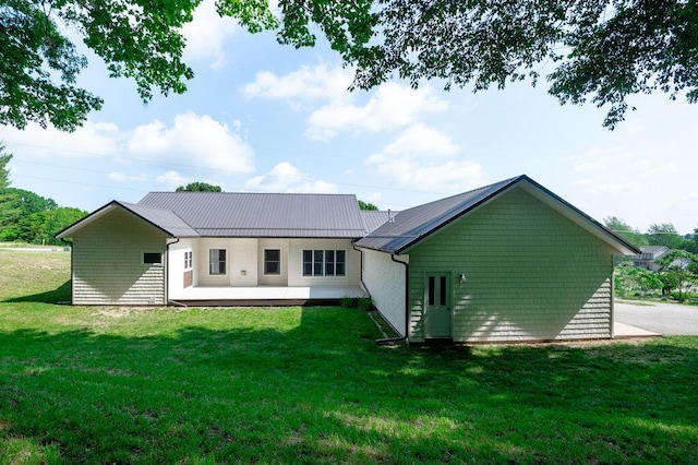 5412 Blackberry Ln, Coloma, MI 49038 - back of property featuring a yard, a metal roof, and a wooden deck