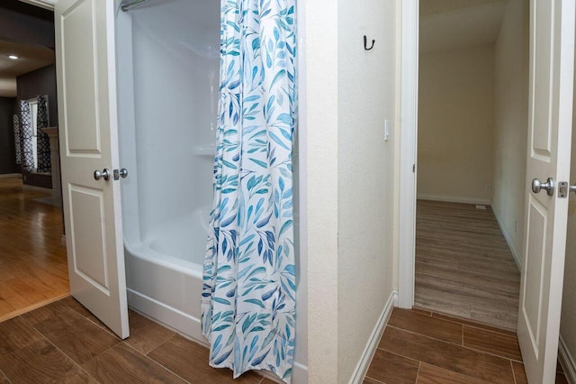5412 Blackberry Ln, Coloma, MI 49038 - full bath with wood finished floors and shower / bath combo with shower curtain