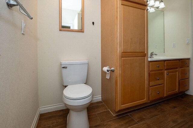 5412 Blackberry Ln, Coloma, MI 49038 - bathroom featuring wood finished floors and vanity