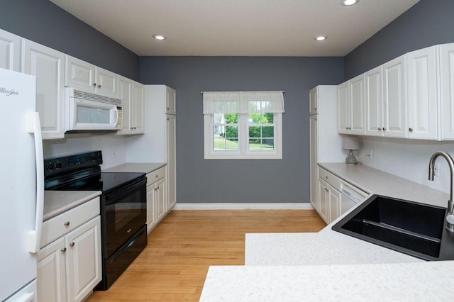 5412 Blackberry Ln, Coloma, MI 49038 - kitchen featuring white appliances, white cabinets, light wood-style flooring, decorative backsplash, and recessed lighting