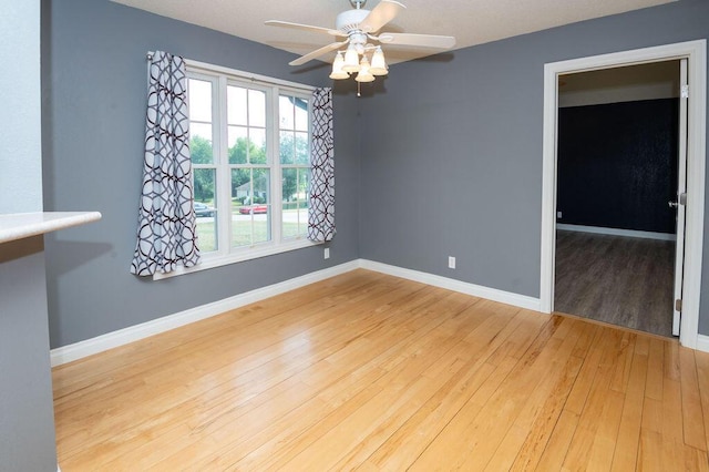 5412 Blackberry Ln, Coloma, MI 49038 - unfurnished room with a ceiling fan and hardwood / wood-style floors