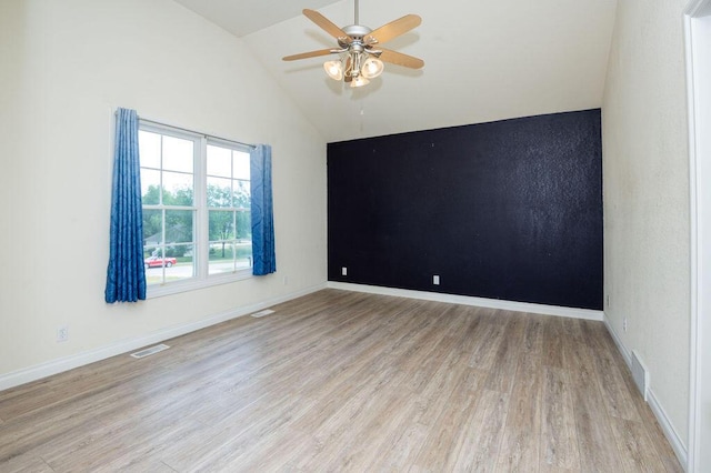 5412 Blackberry Ln, Coloma, MI 49038 - empty room with vaulted ceiling, ceiling fan, and wood finished floors