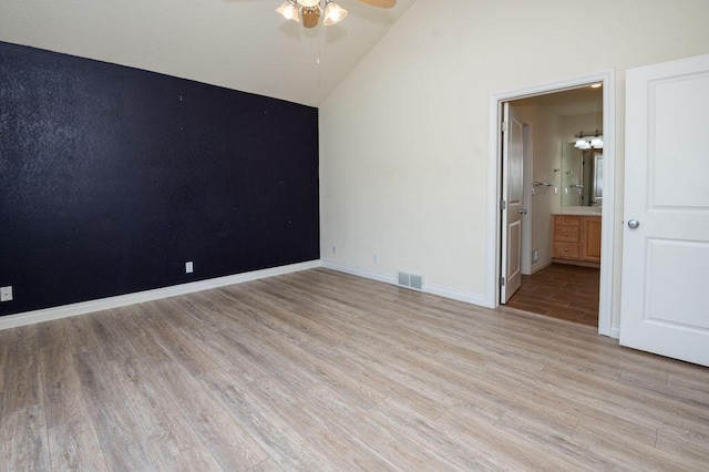 5412 Blackberry Ln, Coloma, MI 49038 - unfurnished room featuring ceiling fan, light wood-style flooring, and vaulted ceiling