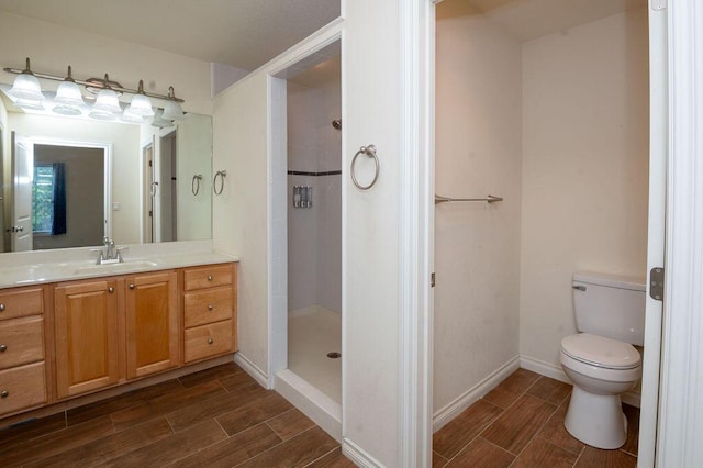 5412 Blackberry Ln, Coloma, MI 49038 - bathroom featuring wood tiled floors, vanity, and a stall shower