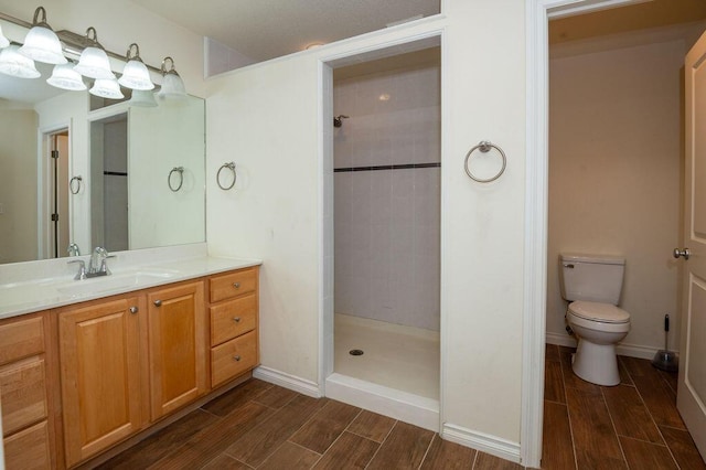 5412 Blackberry Ln, Coloma, MI 49038 - full bath featuring wood finish floors, tiled shower, and vanity