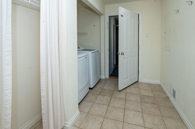 5412 Blackberry Ln, Coloma, MI 49038 - washroom featuring washer and clothes dryer and light tile patterned floors