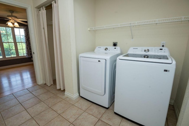 5412 Blackberry Ln, Coloma, MI 49038 - laundry room featuring washer and clothes dryer, ceiling fan, and light tile patterned floors