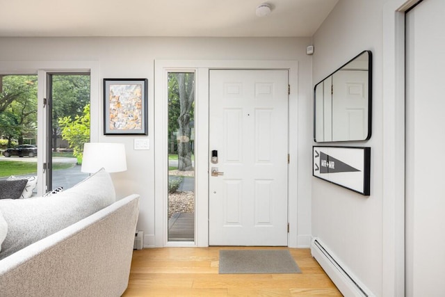 4330 Eastgate Dr, Ann Arbor, MI 48103 - foyer featuring plenty of natural light, a baseboard radiator, and light wood-type flooring