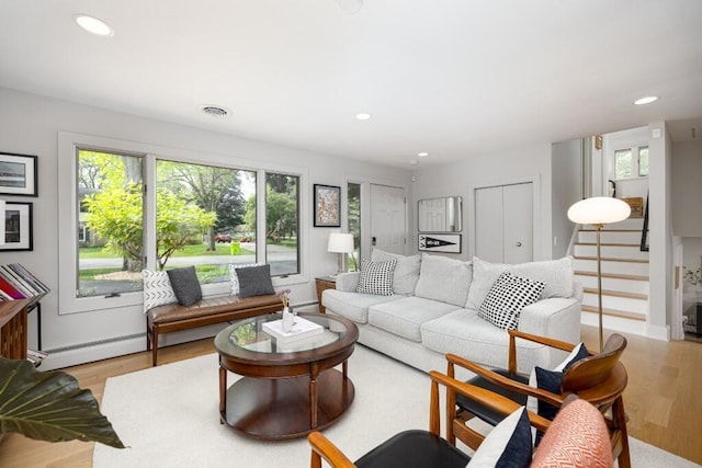 4330 Eastgate Dr, Ann Arbor, MI 48103 - living area featuring baseboard heating, plenty of natural light, light wood finished floors, and recessed lighting