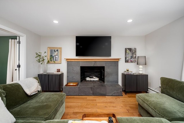 4330 Eastgate Dr, Ann Arbor, MI 48103 - living area featuring wood finished floors, a tile fireplace, and recessed lighting