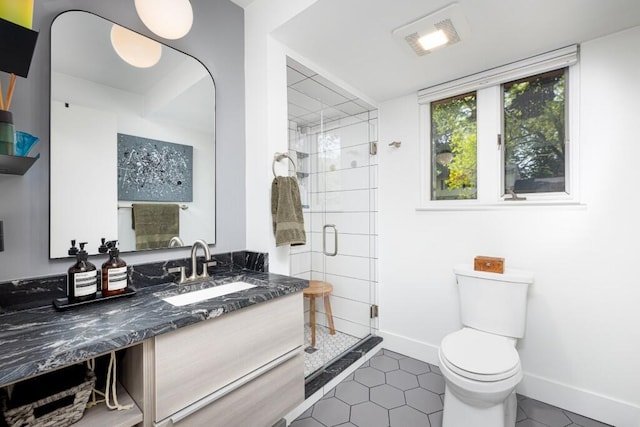 4330 Eastgate Dr, Ann Arbor, MI 48103 - full bath featuring vanity, a shower stall, and tile patterned flooring