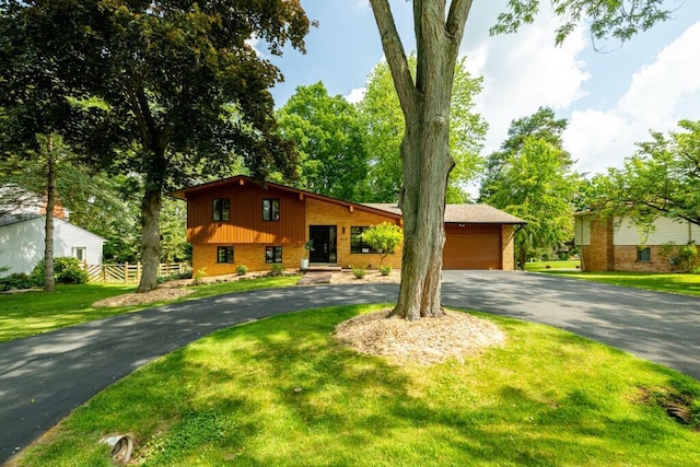 4330 Eastgate Dr, Ann Arbor, MI 48103 - split level home featuring brick siding and asphalt driveway