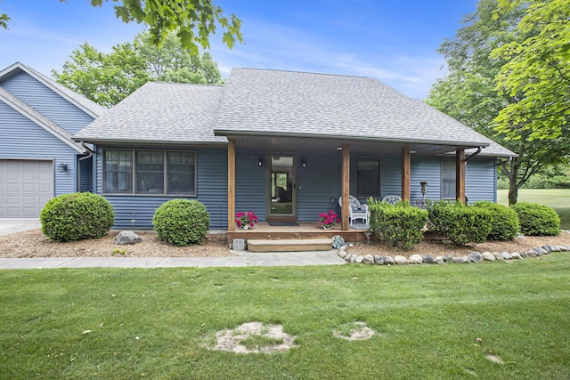 7272 E M 113, Kingsley, MI 49649 - view of front of home featuring a shingled roof, a front lawn, covered porch, and an attached garage