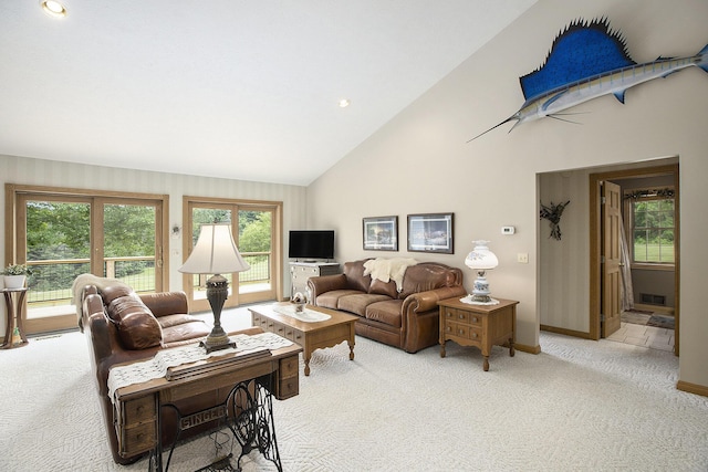 7272 E M 113, Kingsley, MI 49649 - living room featuring light carpet and high vaulted ceiling