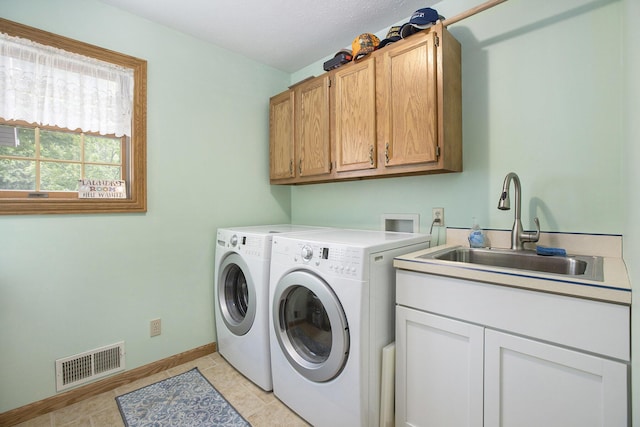 7272 E M 113, Kingsley, MI 49649 - washroom with cabinet space, independent washer and dryer, and light tile patterned flooring