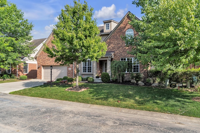 50501 Elmwood Ct, Plymouth, MI 48170 - view of front of house with brick siding, driveway, a front yard, and an attached garage