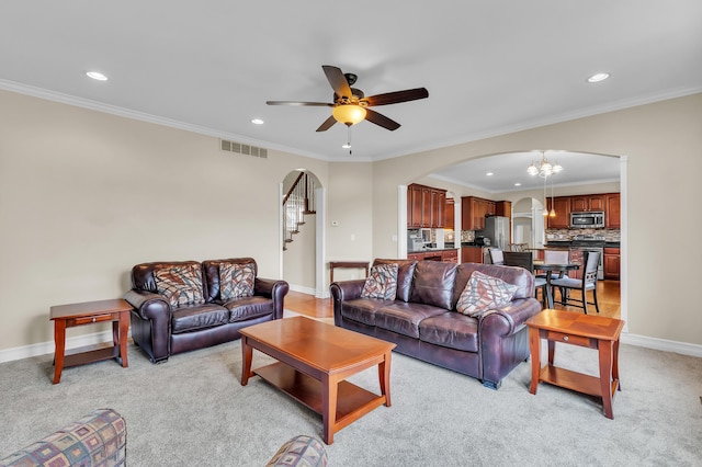 50501 Elmwood Ct, Plymouth, MI 48170 - living room featuring arched walkways, recessed lighting, a ceiling fan, a chandelier, and crown molding