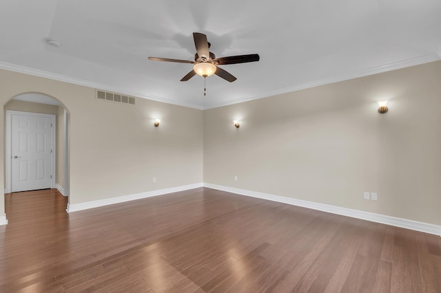 50501 Elmwood Ct, Plymouth, MI 48170 - empty room featuring arched walkways, a ceiling fan, a smoke detector, dark wood-style flooring, and ornamental molding